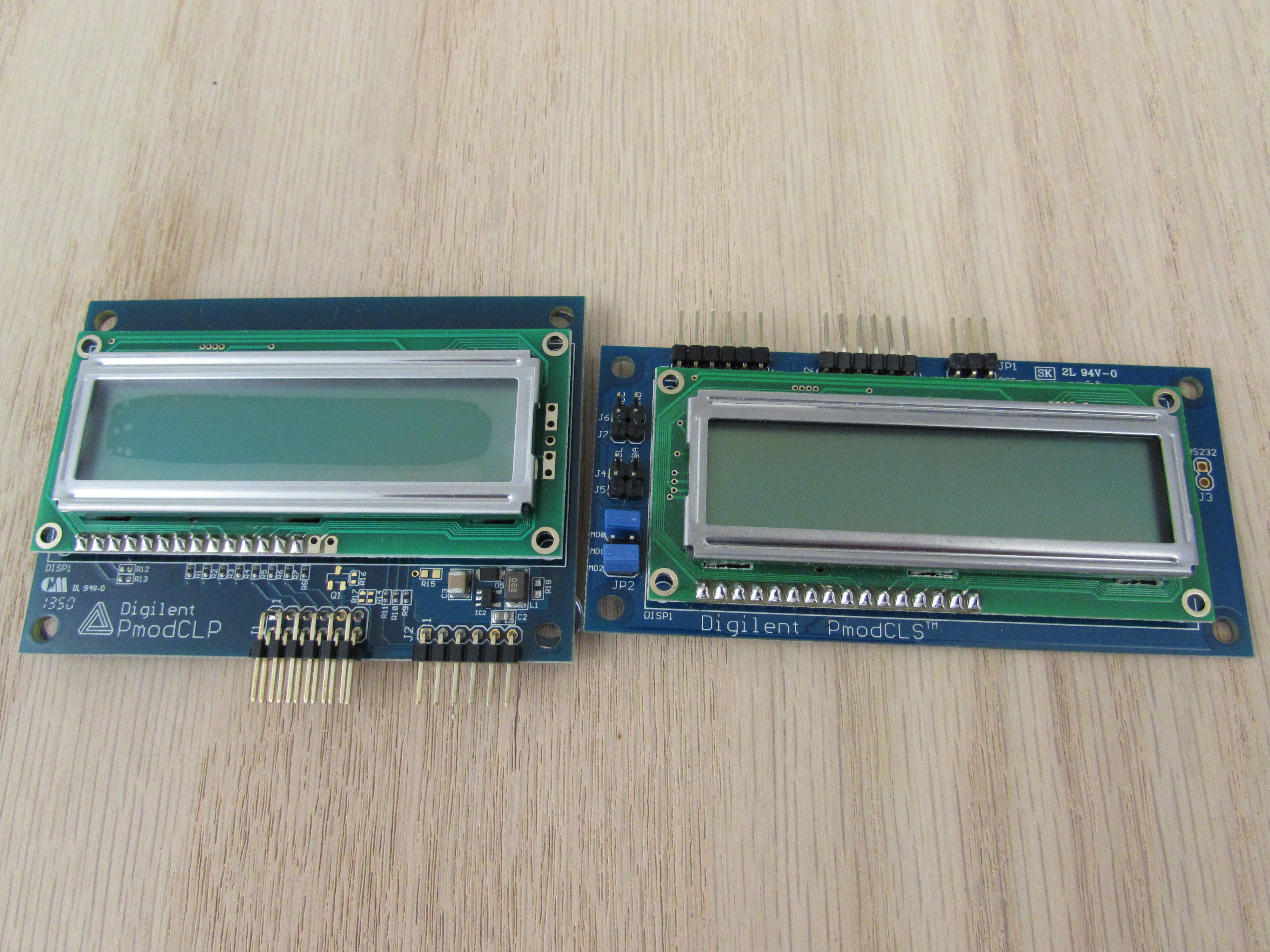 Digilent's two LCD modules: the PmodCLP and the PmodCLS