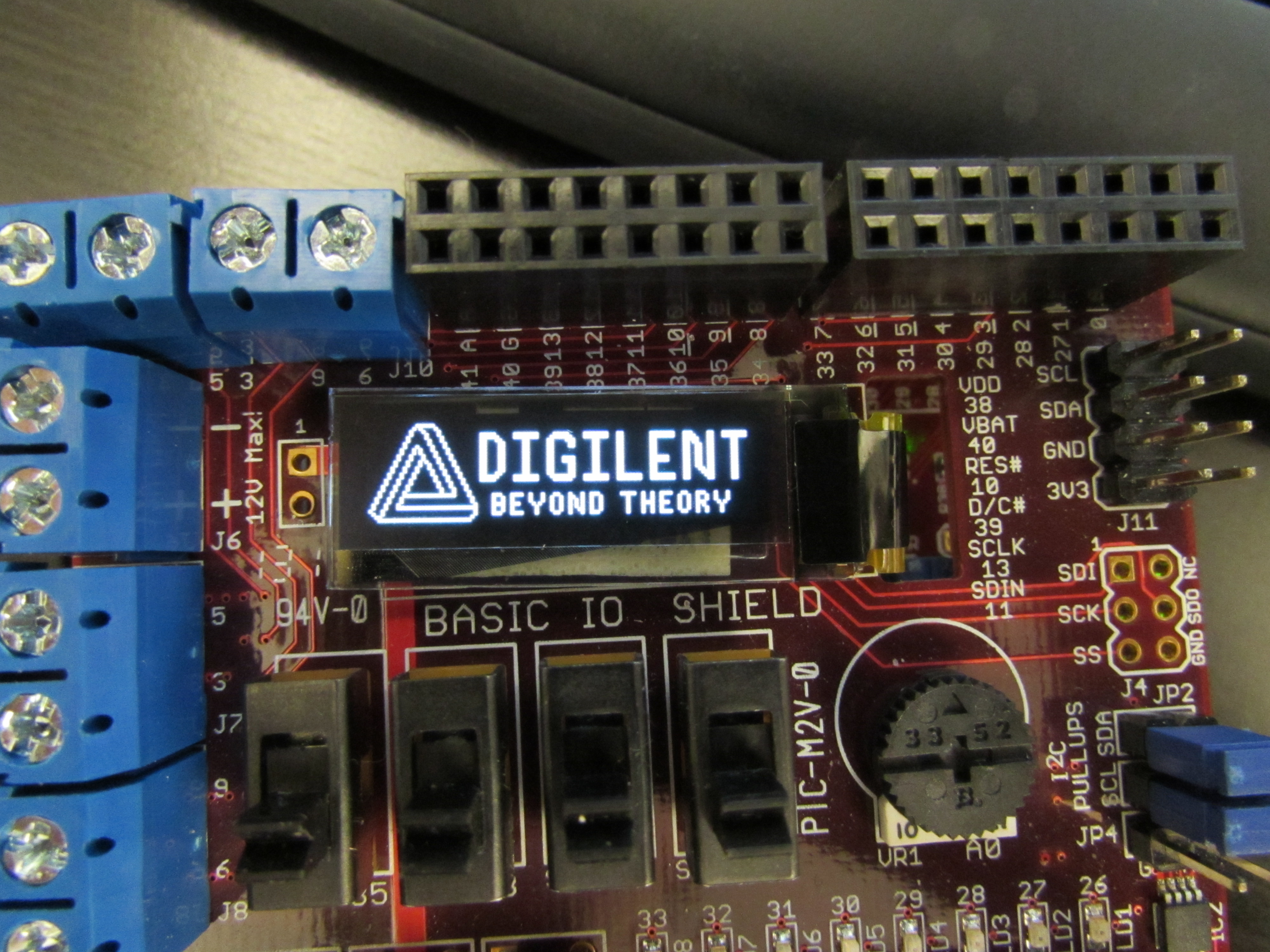 One of Digilent's logos on the PmodOLED present on the Basic I/O Shield