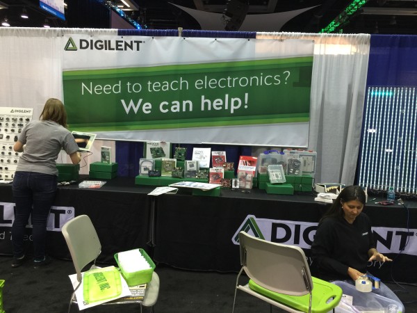 Kaitlyn setting up the booth- with our banner. 