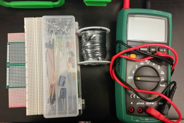 Things to troubleshoot electronics. A few breadboards, protoboard, wire and a Digital Muli Meter. 