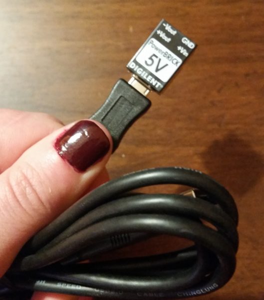 The Power Brick, plugged into a micro USB connector. 