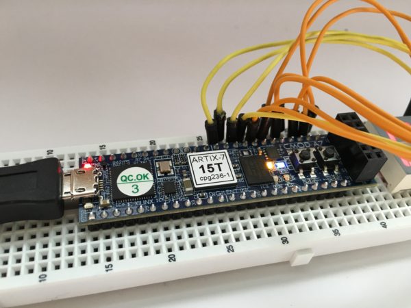 cmoda7 in a breadboard wired to seven segment display